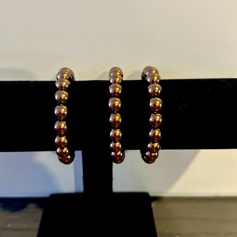 Set of three thick beaded bronze colored bracelets